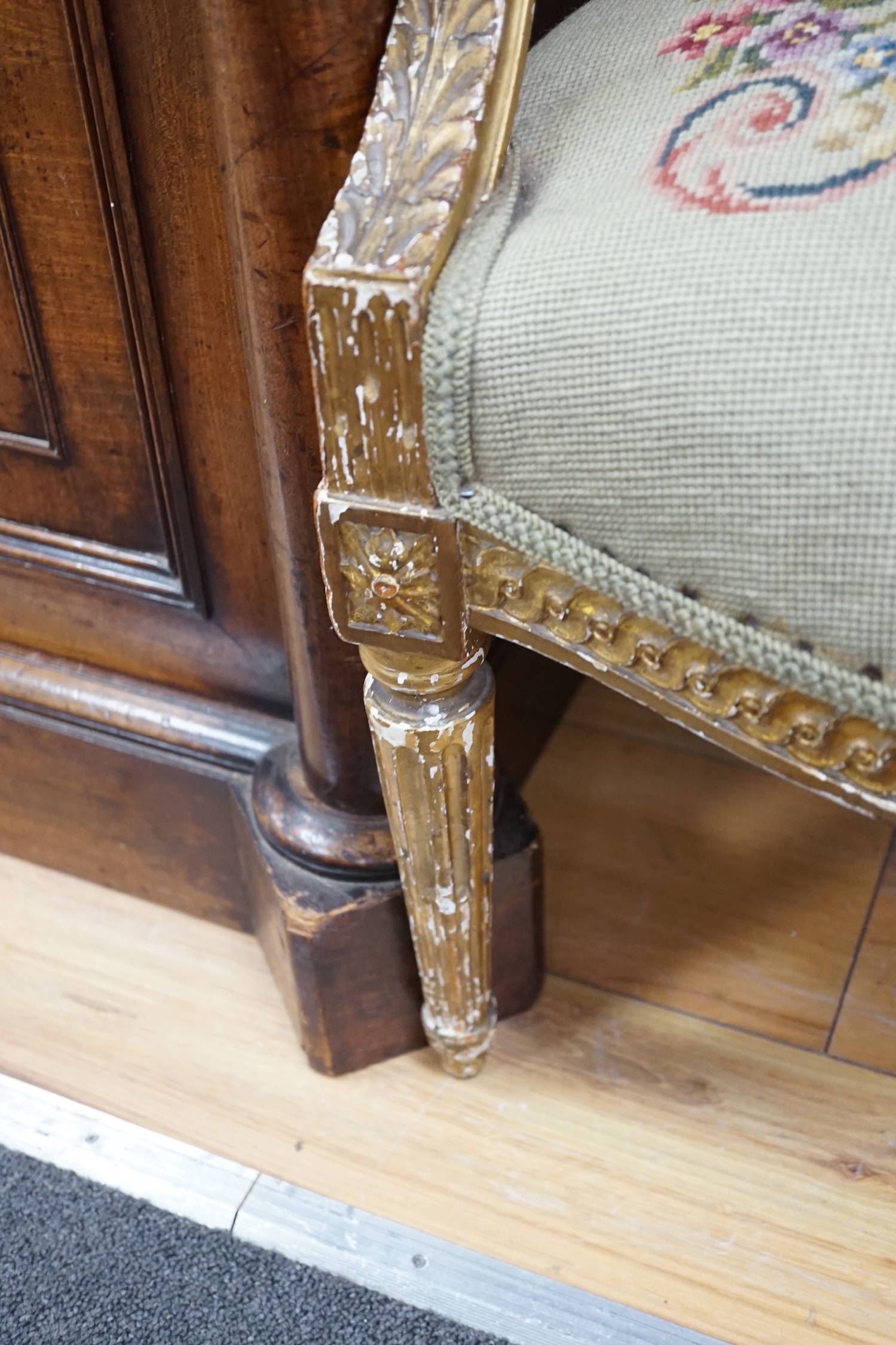 A 19th century French giltwood and composition fauteuil with tapestry upholstery, width 59cm, depth 46cm, height 90cm